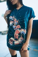 Dark blue shirt with 10 space corgis flying around space with a space cat in a corgi onsie in the back of the shirt